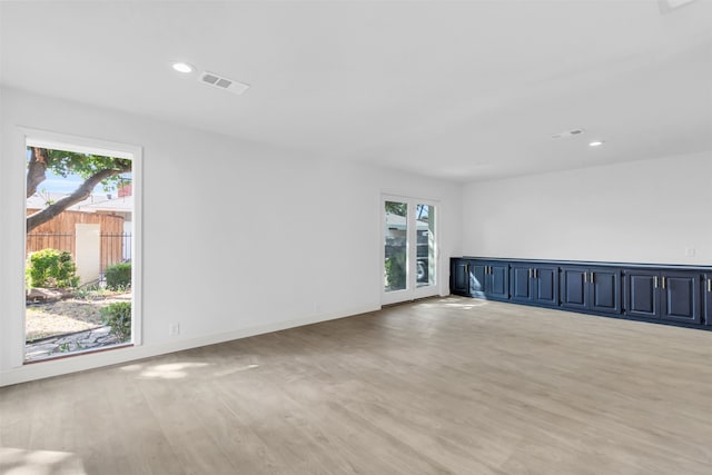 spare room with light hardwood / wood-style flooring