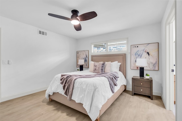 bedroom with ceiling fan and light hardwood / wood-style floors