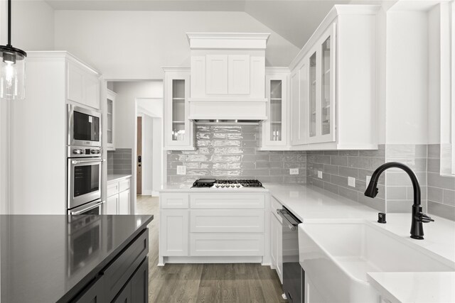 2614 Shadybrook Dr, Celina, TX 75009 - kitchen featuring white cabinetry, decorative backsplash, appliances with stainless steel finishes, and a sink