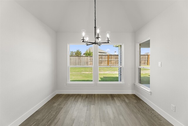 2614 Shadybrook Dr, Celina, TX 75009 - unfurnished dining area featuring baseboards, a wealth of natural light, dark wood finished floors, and a chandelier