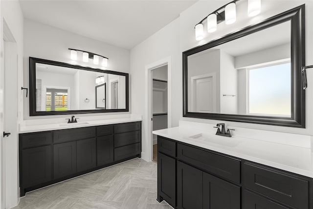 bathroom with vanity and a healthy amount of sunlight