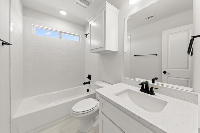 full bathroom with vanity, toilet, and washtub / shower combination