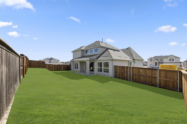 2614 Shadybrook Dr, Celina, TX 75009 - rear view of house featuring a yard, a residential view, and a fenced backyard
