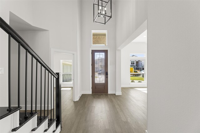 2614 Shadybrook Dr, Celina, TX 75009 - foyer entrance featuring stairs, an inviting chandelier, a towering ceiling, and wood finished floors