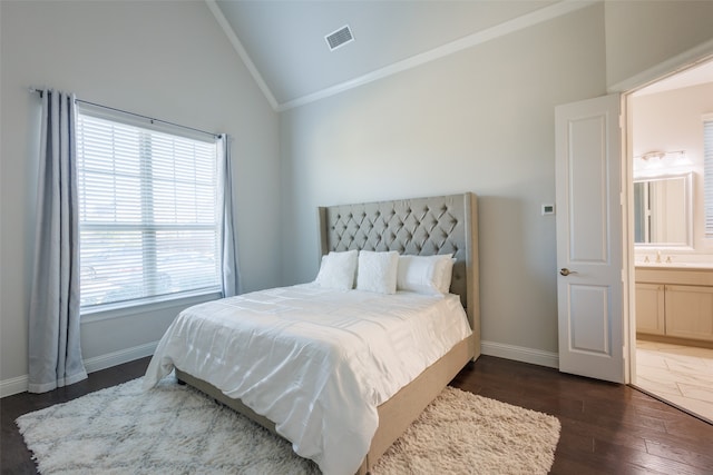 bedroom with dark hardwood / wood-style flooring, sink, ornamental molding, high vaulted ceiling, and connected bathroom