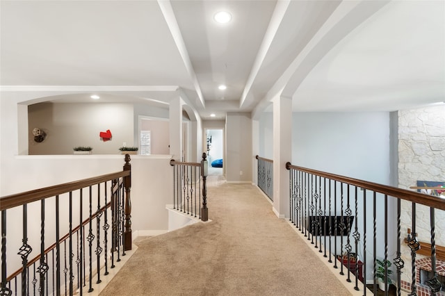 corridor featuring light carpet