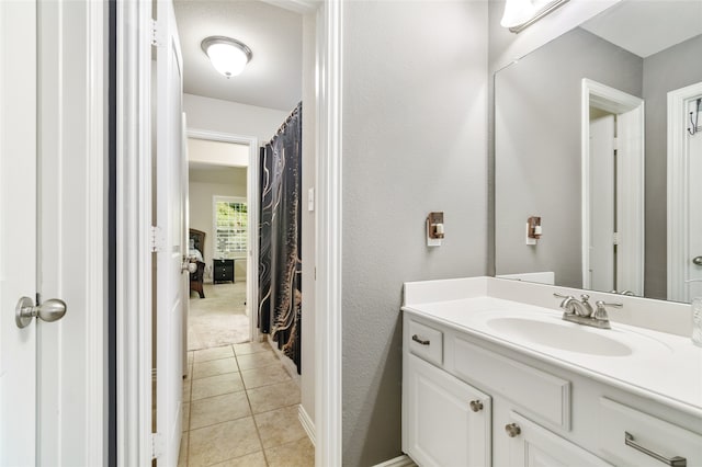 bathroom with vanity and tile patterned flooring