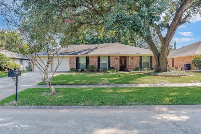 ranch-style home featuring a front yard and a garage