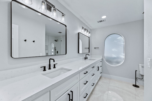 bathroom with vanity and toilet