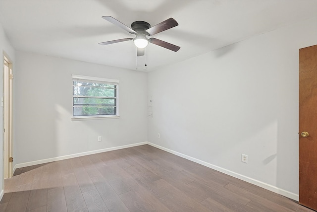 unfurnished room with hardwood / wood-style floors and ceiling fan