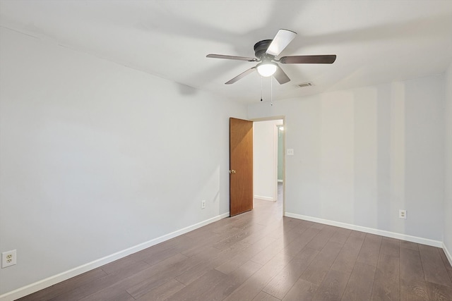 spare room with wood-type flooring and ceiling fan