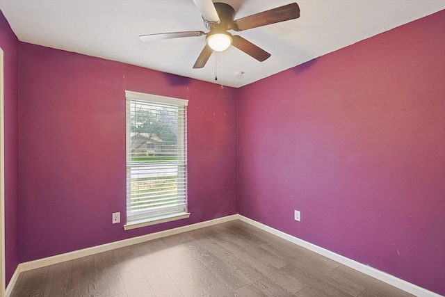 empty room featuring ceiling fan and wood-type flooring