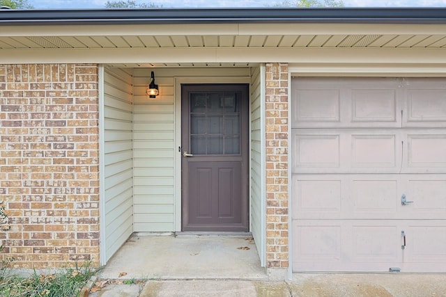 entrance to property featuring a garage