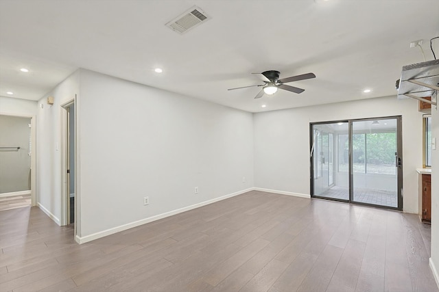 empty room with light hardwood / wood-style floors and ceiling fan