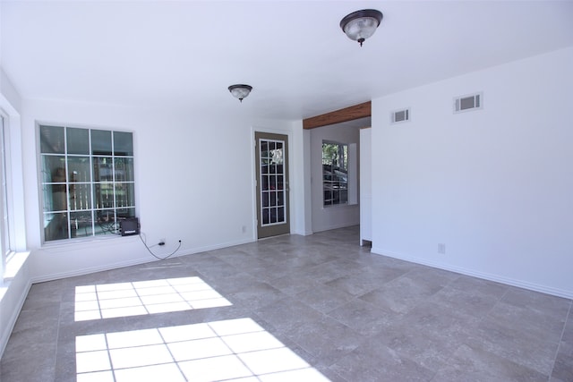 unfurnished room with a healthy amount of sunlight