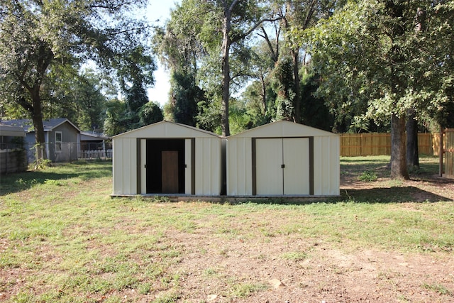 view of outdoor structure featuring a lawn