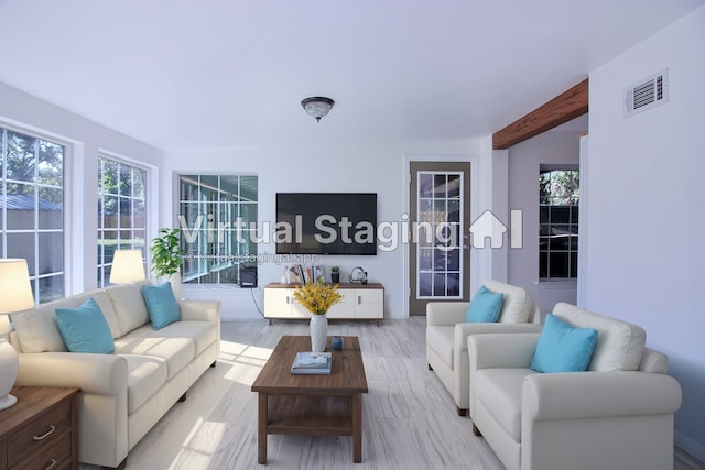 living room with beamed ceiling and light hardwood / wood-style floors