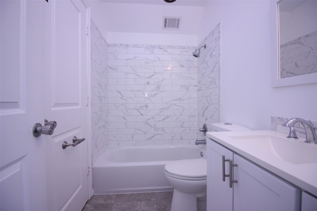 full bathroom featuring tiled shower / bath combo, vanity, and toilet