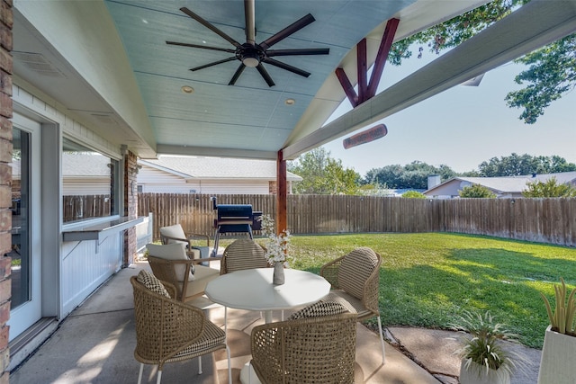 view of patio with ceiling fan and a grill