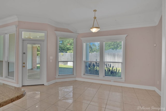 unfurnished dining area featuring crown molding, light tile patterned floors, and plenty of natural light