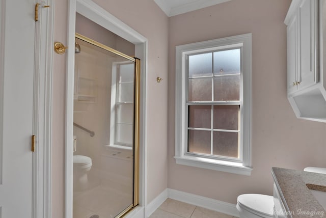 bathroom with a shower with door, toilet, ornamental molding, vanity, and tile patterned flooring