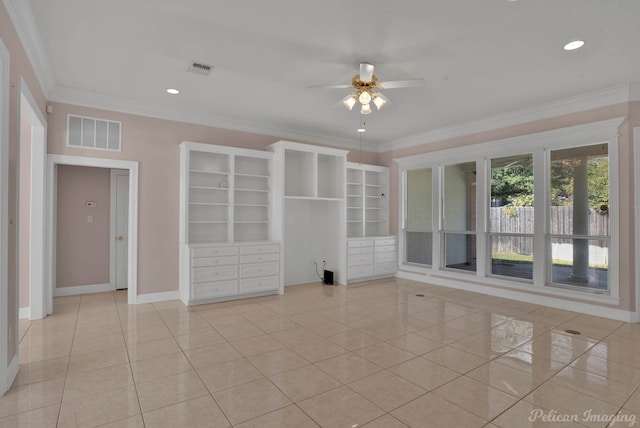 spare room featuring crown molding, light tile patterned floors, and ceiling fan