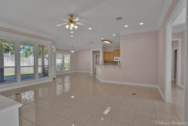 unfurnished living room with crown molding, light tile patterned floors, and ceiling fan