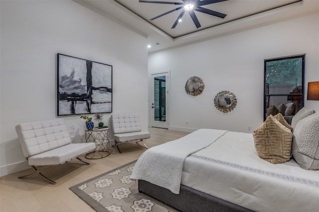 bedroom featuring hardwood / wood-style flooring and ceiling fan