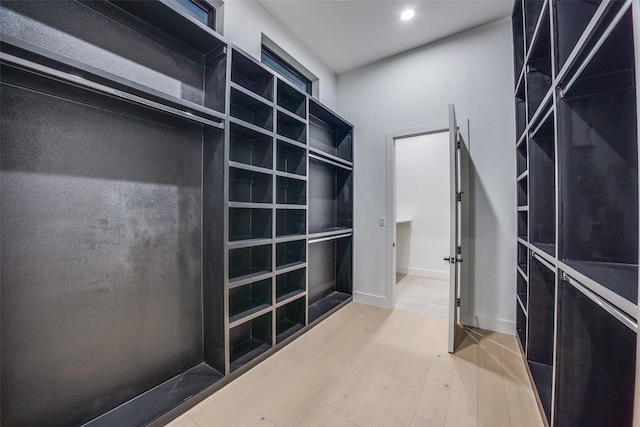 spacious closet featuring light wood-type flooring