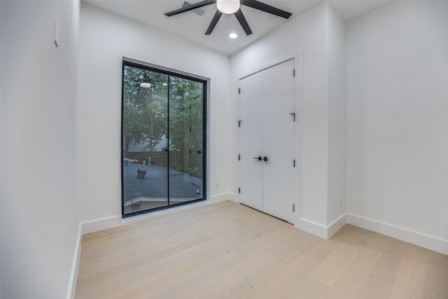 unfurnished room featuring ceiling fan and light hardwood / wood-style flooring