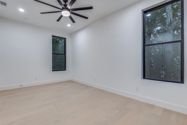 unfurnished room featuring light wood-type flooring and ceiling fan