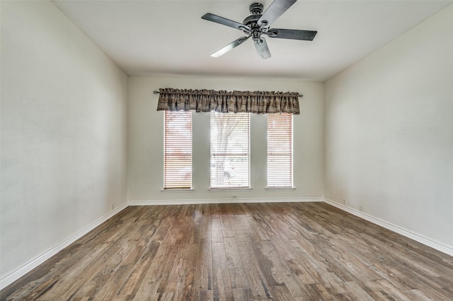 232 Touchdown Dr, Irving, TX 75063 - empty room with wood finished floors, ceiling fan, and baseboards