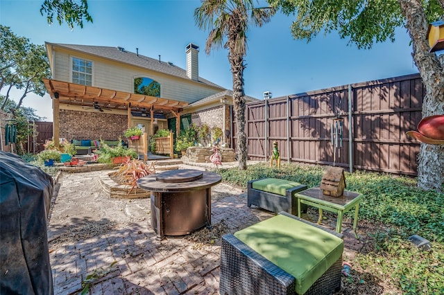 232 Touchdown Dr, Irving, TX 75063 - view of patio / terrace with an outdoor fire pit, a ceiling fan, a fenced backyard, and a pergola
