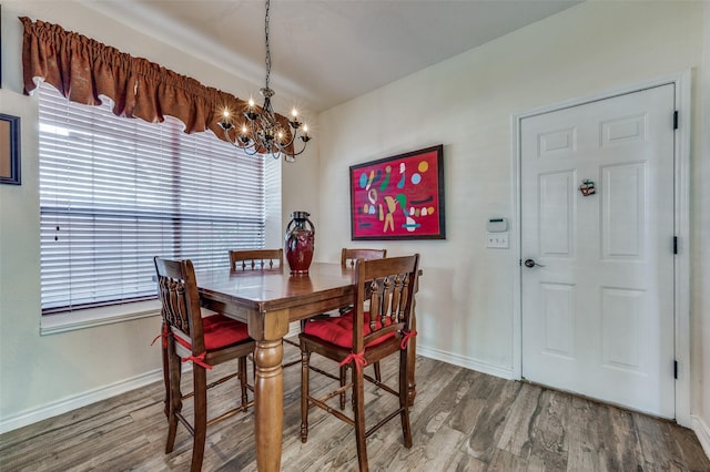 232 Touchdown Dr, Irving, TX 75063 - dining room with a chandelier, wood finished floors, baseboards, and healthy amount of natural light