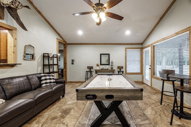 rec room with ornamental molding, lofted ceiling, and ceiling fan