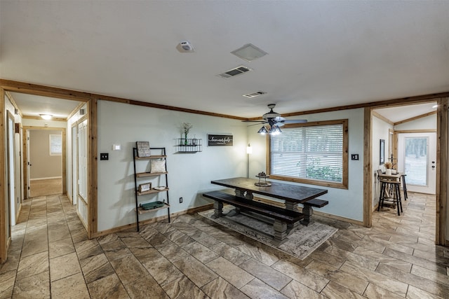 dining space featuring ceiling fan and crown molding