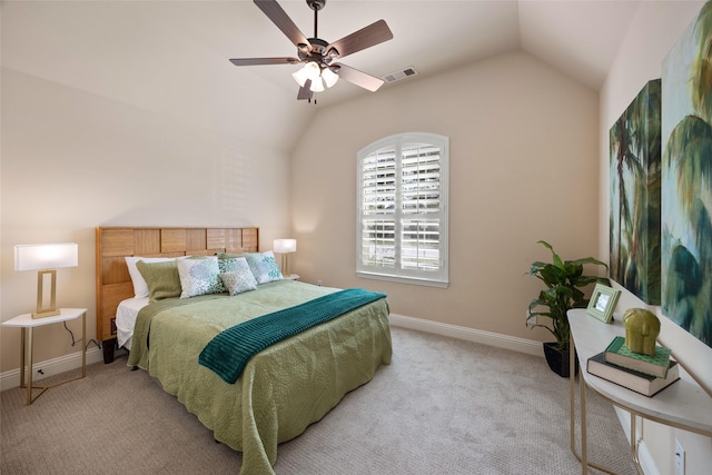 carpeted bedroom with vaulted ceiling and ceiling fan