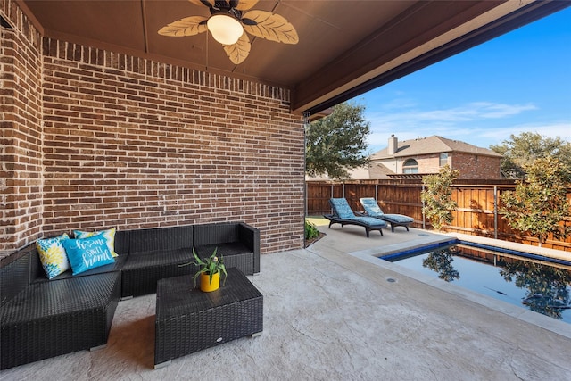 view of patio featuring an outdoor living space and ceiling fan