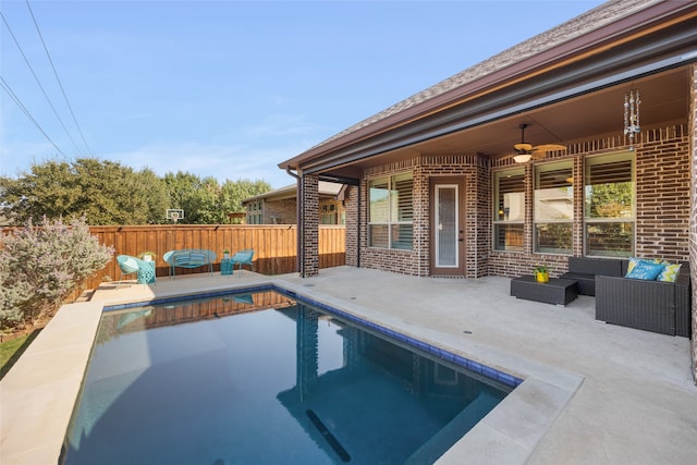 view of pool with ceiling fan, an outdoor hangout area, and a patio area