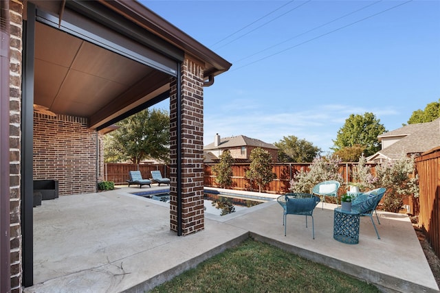 view of patio featuring a fenced in pool