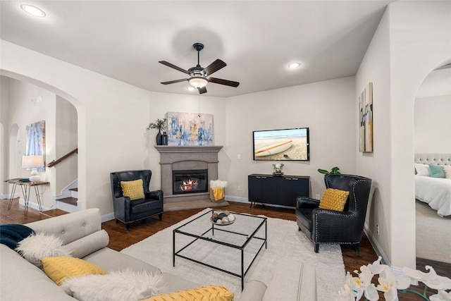 living room with hardwood / wood-style flooring and ceiling fan