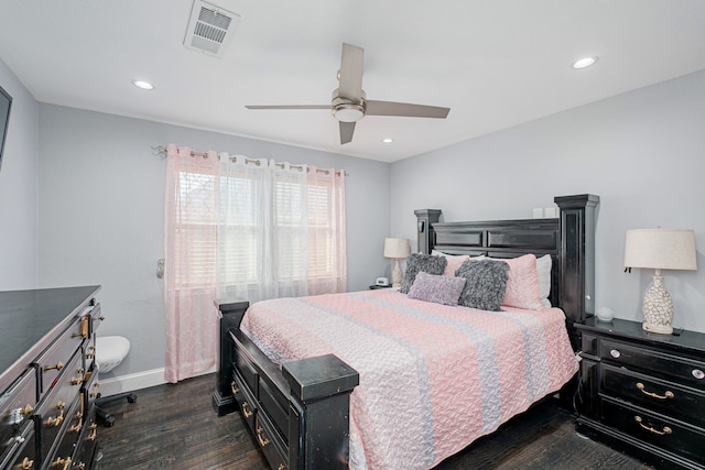 bedroom with ceiling fan and dark hardwood / wood-style floors