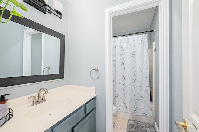 full bathroom featuring vanity, toilet, shower / bathtub combination with curtain, and tile patterned floors