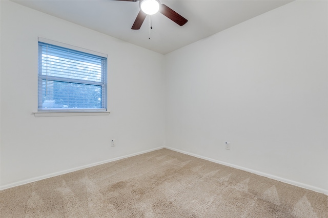 unfurnished room featuring carpet floors and ceiling fan