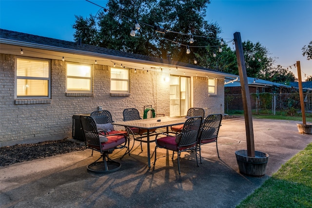 view of patio terrace at dusk