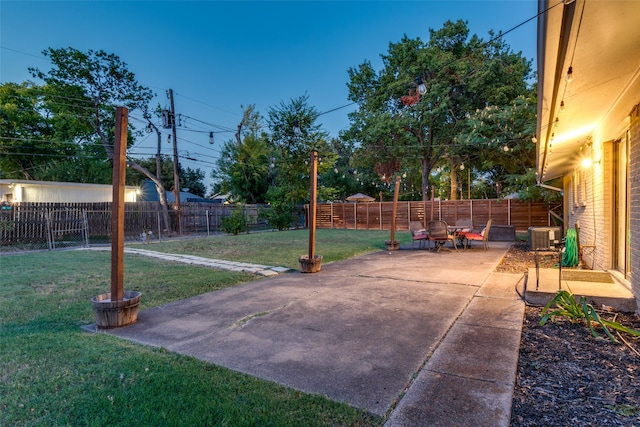 view of yard featuring a patio and central AC unit