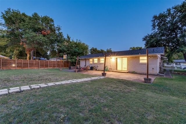 exterior space with a lawn and a patio