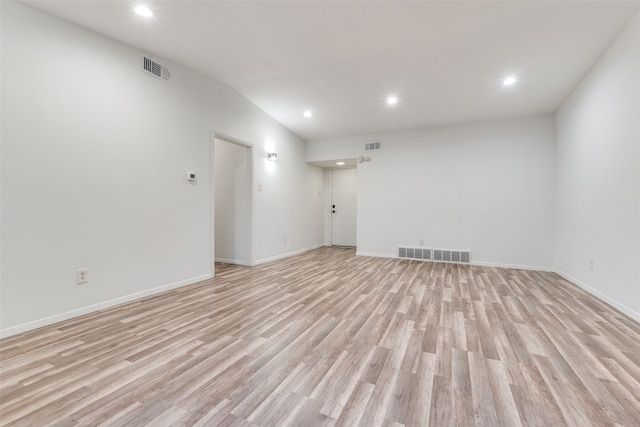 spare room with light hardwood / wood-style flooring