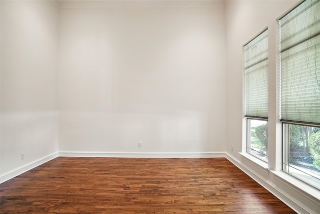 empty room featuring dark wood-type flooring