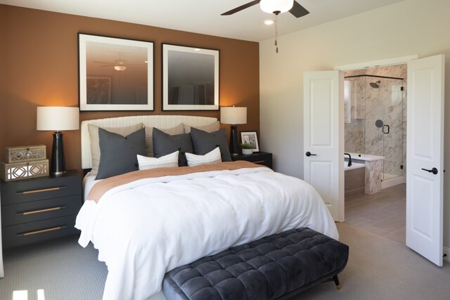 tiled bedroom with connected bathroom and ceiling fan